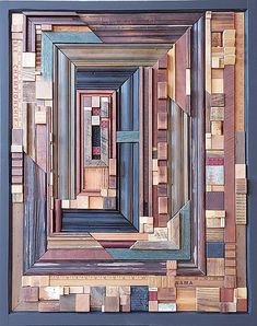 an art piece made out of wood with different colors and shapes on the sides, including squares