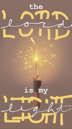 a hand holding a sparkler with the words, the lord is my light