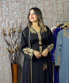 Traditional Black V-neck Abaya, Embroidered Black Kaftan For Traditional Ceremonies, Black Kaftan For Eid And Traditional Ceremonies, Traditional Black Festive Kimono, Black Long Kaftan With Intricate Embroidery, Traditional V-neck Black Abaya, Black Kaftan With Intricate Embroidery For Festivals, Black V-neck Kaftan For Festive Occasions, Elegant Black Kaftan For Festivals