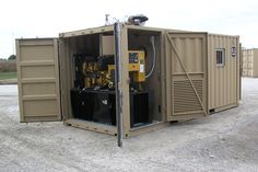 there is a small portable generator in the back of a shipping container with its doors open