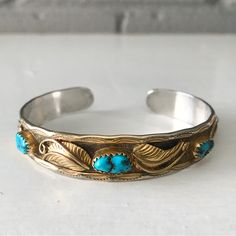 Add To Your Collection Of Vintage & Southwestern Goodies W/ This Beautiful Turquoise & Sterling Stacker Cuff! Five Bright, Stunning Turquoise Stones Are Set In Sterling Coated With 12k Gold Fill On A Band Detailed With Feathers/Leaves And Other Stamping & Native Accents. Has A Classic Southwestern Look Is Perfect Stacked W/ Other Favorites As Well! Excellent Vintage Condition, Only Very Minor Signs Of Vintage Use (See Pics). Ready To Wear! A Unique Piece As Turquoise Is Not As Often Found With G Gold C, Gold Cuffs, Turquoise Stones, Vintage Turquoise, Adjustable Bracelet, Turquoise Stone, Jewelry Vintage, Womens Jewelry Bracelets, Blue Gold