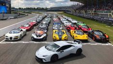 a group of cars driving down a race track with the words video on it's side