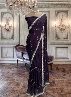 Beautiful deep purple satin georgette saree with mirror work and running blouse piece. Elegant Purple Pre-draped Saree, Purple Georgette Pre-draped Saree For Festivals, Purple Pre-draped Saree With Cutdana For Party, Purple Embellished Pre-draped Saree, Embellished Purple Pre-draped Saree, Purple Embellished Georgette Pre-draped Saree, Evening Silk Saree With Mirror Work, Purple Georgette Pre-draped Saree For Evening, Purple Silk Pre-draped Saree For Party