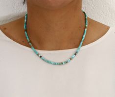 Celebrate December birthdays with our stunning collection of Bohemian chokers and necklaces, featuring genuine turquoise gemstones known for their healing properties. Our artisan handmade turquoise necklaces and bracelets are crafted with top-quality gemstones and meticulous attention to detail. These dainty chokers and minimalist necklaces, adorned with tiny square 3 mm turquoise beads, are perfect for layering or wearing alone. Ideal for weddings, bridesmaids, or as a thoughtful gift for men a Turquoise Spacer Beads Jewelry For Festival, Adjustable Dainty Turquoise Necklace With Round Beads, Minimalist Blue Choker With Round Beads, Minimalist Blue Round Beads Choker, Minimalist Blue Jewelry For Festivals, Minimalist Single Strand Turquoise Beaded Necklace, Minimalist Beaded Turquoise Necklace, Minimalist Turquoise Single Strand Beaded Necklace, Adjustable Turquoise Dainty Choker