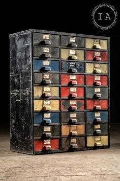 an old metal filing cabinet filled with lots of drawers