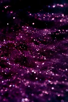 an abstract purple background with lots of small bubbles