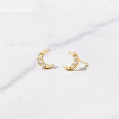 Tiny moon stud earrings! Perfect for a minimalist or for stacking! - - - D E T A I L S - - - * Made of 925 Sterling Silver * We use a THICK, DURABLE plating of 14K Gold, Rose Gold or Rhodium - for a piece that will last you years to come! * Highest Grade CZ for an authentic diamond look! * Nickel-free & Hypoallergenic * Length: 5.4mm ♥︎ ♥︎ ♥︎ Model Details ♥︎ ♥︎ ♥︎ 2nd Hole- https://www.etsy.com/listing/1154500077/tiny-ball-stud-earrings-ball-studs-stud?click_key=772e6d7f7021c5b7e72d2c2498531b61 Dainty Crescent Earrings For Everyday, Crescent Shaped Pierced Earrings For Gifts, Elegant Hypoallergenic Moon Shaped Earrings, Round Earrings With Moon Charm For Anniversary, Crescent Earrings For Anniversary, Moon Shaped Cartilage Earring As Gift, Moon Shaped Single Cartilage Earring As Gift, Celestial Crescent Earrings For Everyday, Everyday Celestial Round Earrings