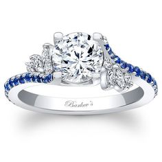 a diamond and blue sapphire engagement ring