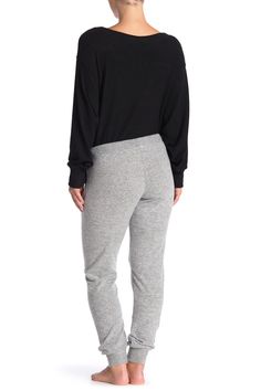 Comfy jogger pants composed of super-soft brushed knit add lounge-worthy style and comfort perfect for a night in.Fit: this style fits true to size. Elasticized drawstring waist. Pull-on style. Side slash pockets. Brushed knit construction. Ribbed ankles. Approx. 10" rise, 32" inseam (size S). Imported Winter Sweats With Elastic Waistband For Loungewear, Trendy Loungewear Sweats With Ribbed Cuffs, Trendy Sweats With Ribbed Cuffs For Loungewear, Winter Joggers With Elastic Waistband For Lounging, Cozy Fit Sweatpants With Elastic Cuffs, Cozy Sweatpants With Elastic Cuffs, Trendy Joggers With Elastic Cuffs For Loungewear, Trendy Sweatpants With Elastic Waistband For Loungewear, Comfortable Cozy Sweatpants With Elastic Cuffs