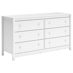 a white dresser with four drawers and two knobs