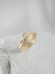 "A Perfect ring for an engagement & wedding or even as an elegant layer for an everyday ring mix. This is a truly unique piece, filled with elegance and charm and \"movement\". It is bound to become a cherished gift for your loved one. > 14K or 9K solid gold, also available in Goldplated Silver. > Can be made in yellow, white and rose 9k or 14k solid gold. Please choose a material > Ring width:approximately 4 mm > Handmade in Greece For additional sizes (also for quarter and half Modern Twist Oval Rings For Anniversary, Elegant Wedding Diamond Ring In Recycled Gold, Oval Jewelry With A Modern Twist For Weddings, Modern Twist Oval Wedding Jewelry, Modern Twist Jewelry With Ring Detail Gift, Modern Twist Jewelry With Ring Detail As Gift, Modern Jewelry With Ring Detail As A Gift, Elegant Stackable Rings In Recycled Gold As A Gift, Modern Twist Open Ring For Anniversary