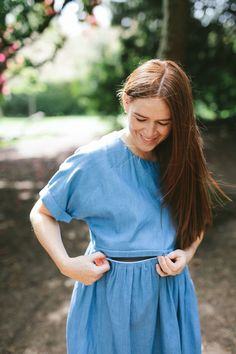 A denim look nursing dress designed for breastfeeding and maternity. A smock length dress with rolled short sleeves  and a casual fit. At Ruma Breastfeeding Wear we design dresses for nursing and maternity that match your pre baby style. Dress for breastfeeding and maternity with a unique two way, hidden zip that can be opened from either side allowing you to nurse your baby comfortably. We've added a quick video to show you how the zip works. This dress is a midi length with a tiered skirt and Summer Cotton Maternity Dress Nursing Friendly, Summer Maternity Dress Nursing Friendly, Summer Maternity Dress With Nursing Friendly Short Sleeves, Nursing Friendly Short Sleeve Maternity Dress, Cotton Maternity Dress With Short Sleeves, Short Sleeve Cotton Maternity Dress, Summer Maternity Dress With Short Sleeves, Blue Nursing-friendly Maternity Dress With Short Sleeves, Blue Short Sleeve Nursing-friendly Maternity Dress