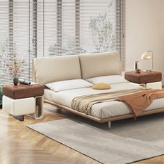 a bed sitting on top of a hard wood floor next to a window covered in blinds