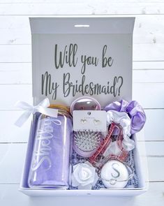 the bridesmaid gift box is filled with personalized items for her special day