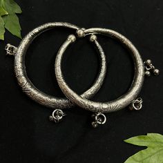 Vastrabhushan Silver Oxidized Charm Kada are very classic in nature crafted in german silver and finished with silver oxidised. This pair of Bracelet are versatile and the perfect dose of pretty you had want to add to your everyday outfits. Layer and stack with another of the kinds for a bolder look if you are looking to make an impact with your outfit. Item Description: The look is stunning and preciously suitable for all kinds of dressy occasions. COLOR : Silver Metal: Brass With Good Quality Hand Bracelet, German Silver, Hippie Jewelry, Traditional Jewelry, Nature Crafts, Look Alike, Look Plus, Arm Band, Everyday Outfits