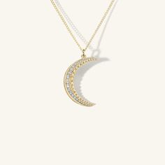 Expanding and disappearing in its poetic and cyclical cadence, the Crescent Moon is a symbol of the constant renewal of nature. Pictured on our Curb Chain in image one, and our Puffed Mariner Chain with a Pavé Diamond Swivel in image two. In image three, Smaller Crescent is pictured on our Baby Curb Chain, Larger Crescent pictured on an Esmé Paperclip Chain with a Pavé Diamond Swivel. Luxury Crescent-shaped White Gold Jewelry, Luxury White Gold Moon-shaped Jewelry, Celestial Crescent Jewelry In White Gold, Celestial Crescent White Gold Jewelry, White Gold Moon-shaped Jewelry For Formal Occasions, Formal White Gold Moon-shaped Jewelry, Formal White Gold Moon Shaped Jewelry, Formal Round Moon Phase Jewelry, Formal Moon Phase Jewelry