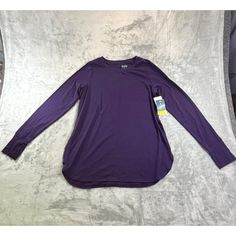 Stay Warm And Stylish In This Purple Tek Gear Women's Medium On The Go Long Sleeve Shirt. Featuring Thumb Holes For Extra Comfort, This Shirt Is Perfect For An Active Lifestyle. Brand: Tek Gear Color: Purple Size: Medium Style: T-Shirt Material: Polyester And Spandex Special Feature: Thumb Holes Features: T-Shirt Size: Womens Medium Condition: New With Tags Brand New Fall Crew Neck Purple Blouse, Purple Crew Neck Blouse For Fall, Fall Purple Crew Neck Blouse, Purple Cotton Top For Layering, Purple Crew Neck Top For Layering, Purple Long Sleeve Top For Daywear, Purple Relaxed Fit Long Sleeve Top, Purple Long Sleeve Relaxed Fit Top, Basic Long Sleeve Purple Top