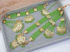 Shop These Beautiful BILQUEES Jadau Complete Bridal jewellery Set for all Vibrant colors for your special events.    Gold base filled with pearl and zirconia and crystal beads. Choose from two colors: Baby Pink and Mint Green    Set Includes- Choker, Rani Haar, Passa, Tikka and Earrings. Jeweled Kundan Necklace With Round Beads For Wedding, Green Pearl Bridal Necklace For Wedding, Bridal Jewellery Set, Rani Haar, Pink And Mint, Jewellery Set, Bridal Jewelry Sets, Bridal Jewellery, Baby Pink