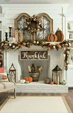 a fireplace decorated for thanksgiving with pumpkins and gourds