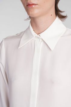 Keltie Shirt in beige silk, collar, long sleeves, hidden closure with buttons, buttons on the wrists, straight hem, semisheer, 100% silk, Made in Lithuania, Model is 180 cm and wears 36 Timeless Collared Silk Top, Timeless Silk Collared Top, Silk Button-up Blouse With Cuffed Sleeves, Timeless Silk Blouse For Daywear, Formal Silk Blouse With Spread Collar, Elegant Silk Tops With Hidden Button Closure, Elegant Silk Top With Hidden Button Closure, Silk Shirt With Button Closure And Fold Down Collar, Silk Office Shirt With Fold Down Collar