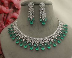 Sea Green Shining CZ Diamonds Necklace Earrings Set/ Silver Bridal Jewelry Set/ Indian Pakistani Party Wear Statement Necklace Earrings Set Metal        = Silver Plated Occasion  = Wedding ,Party Wear, Bridal Color        =  Sea Green + Clear CZ Stones Necklace Size =  8 Inches Earrings Length = 2.5 Inches 100% Satisfaction Guarantee: 1 Year Warranty, Long Lasting Plating, High-Quality Stones Occasion: Perfect choice for any Indian occasion.  Care: It is advisable that you keep products away fro Necklace Set Silver, Cz Stone Necklace, Silver Bridal Jewellery, Bridal Diamond Necklace, Diamond Pendant Jewelry, Necklace With Diamond, Pakistani Party Wear, Wedding Party Wear, Emerald Gem