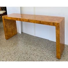 a wooden bench sitting on top of a floor