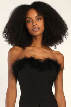 Feather TogetherThis strapless crop top was made for you with its figure-hugging stretch knit fabrication that falls from a straight neckline, adorned with fluffy black feathers. Hidden side zipper. Pair with the matching pants for a complete look! Fit: This garment fits true to size. Length: Size medium measures 12.5" from top to bottom. Bust: Great for any cup size. Waist: Fitted - very fitted at natural waist. Undergarments: May be worn with a strapless bra, adhesive bra, petals, or no bra. F Elegant Bandeau Crop Top For Club, Glamorous Fitted Bandeau Crop Top, Evening Bandeau Tube Top, Glamorous Off-shoulder Fitted Tube Top, Glamorous Fitted Off-shoulder Tube Top, Elegant Cropped Tube Top For Night Out, Trendy Fitted Tube Top For Evening, Glamorous Cropped Tube Top For Evening, Fitted Strapless Crop Top For Evening