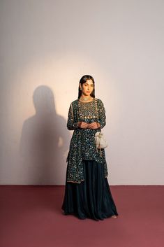 Featuring a royal green printed & embroidered sharara set in viscose georgette base with  saadi, cutdana, mirror, kasab and sequin hand embroidery. It is paired with embroidered viscose glass organza kali sharara and viscose georgette dupatta. Traditional Sharara With Sequins And Straight Kurta, Traditional Sequined Palazzo Set For Diwali, Sequined Straight Kurta Sharara For Reception, Traditional Sequined Palazzo Set For Eid, Georgette Sequin Straight Kurta Set, Traditional Drape Sequin Palazzo Set In Chinon, Diwali Sequin Georgette Palazzo Set, Eid Sequin Sharara With Straight Kurta, Green Chinon Palazzo Set For Reception