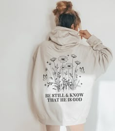 Embrace the comforting message of "Be Still and Know that I am God" with this stylish hoodie, perfect for women seeking trendy Christian apparel that incorporates Bible verses. Stay cozy and fashionable in this oversized sweater designed to reflect a modern aesthetic while spreading a meaningful religious message. ABOUT THE HOODIE Gildan 18500 50% cotton, 50% polyester Medium-heavy fabric  Classic fit Tear-away label Runs true to size Size UP 1-2 Sizes for oversized fit SHIPPING AND PROCESSING A Inspirational Hoodie Sweatshirt For Fall, Inspirational Fall Hoodie Sweatshirt, Oversized Comfortable Hoodie With Letter Print, Oversized Hoodie With Letter Print, Comfortable, Inspirational Letter Print Hoodie For Fall, Inspirational Graphic Print Hoodie For Fall, Inspirational Letter Print Relaxed Fit Hoodie, Inspirational Letter Print Relaxed Hoodie, Inspirational Hooded Sweatshirt With Letter Print