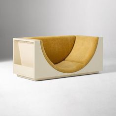 an unusual couch made out of wood and white material with a curved seat on the back