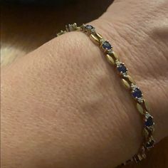 Sterling Silver Cz And Sapphire Stone Gold Plated Bracelet Very Good Condition Elegant Adjustable Blue Gold Bracelet, Elegant Blue Adjustable Gold Bracelet, Elegant Blue Bracelets With Sparkling Stones, Sapphire Bracelets As A Gift, Elegant Blue Bangle Gold Bracelet, Elegant Oval Jeweled Bracelets, Blue Sparkling Stones Bracelet For Formal Occasions, Elegant Oval Jeweled Bracelet, Elegant Jeweled Sapphire Jewelry