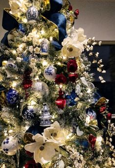 a decorated christmas tree with blue and white ornaments