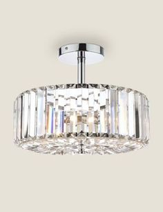 a chrome finish ceiling light with crystal accents