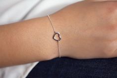 This minimalist bracelet features a heart. A wonderful gift for that special someone to show them how long your love will last :)Adjustable bracelet length from 6.5" to 8".100% sterling silverThis lovely bracelet will arrive in a organza bag, ready for gifting or to keep for yourselfThis simple bracelet adds a special little something to your look!Perfect for everyday wear :)Shipped within 1-2 business days after cleared payment.Don't hesitate to contact me if you have any questions.If this is a Bracelet With Heart, Geometric Bracelet, Bracelet Simple, Simple Bracelets, Minimalist Bracelet, Layered Bracelets, Circle Necklace, Religious Gifts, Heart Bracelet