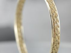 This is such a pretty and classic piece! The texture of the woven center gives the bangle a rich, luxurious profile. It will work great as a stacking bracelet, and is still beautiful all on its own. The condition is fantastic, and the design is light and airy but still substantial with strong, structural lines. Metal: 14K Yellow Gold Width: 6.4 mm Inside Circumference: 7 inches Marks: "14K" Stamped on the clasp Filigree Bangle, Vintage Gold Bracelet, Pearl Bangle Bracelet, Gold Link Necklace, Marquise Shape Diamond, Gold Link Bracelet, Vintage Rose Gold, Pearl Bangle, Tassel Bracelet