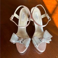 Valentino Garavani Blush Satin Crystal Bow Heels Great Condition. Only Worn Once Size 8 1/2 Pink Luxury Sandals For Formal Occasions, Luxury Pink Sandals For Gala, Pink Almond Toe Heels For Evening, Pink High Heel Gala Shoes, Blush Ankle Strap Heels For Evening, Elegant Pink Ankle Strap Sandals, Pink Heels With Heel Strap For Gala, Feminine Open Heel Formal Heels, Feminine Wedding Heels