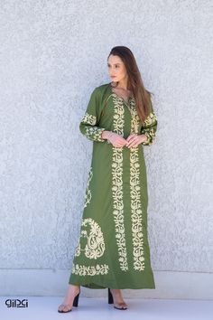 **Note : The kaftan in the video is a different color of the exact same Kaftan and is only displayed to show the fit, flow, and cut of the Kaftan. You will receive the one in the pictures.** Ideal for shorter women, this bohemian embroidered dress is a an eye catcher ! It is an extremely comfortable wear, light and soft and can be used on many occasions -  home gatherings, festival parties, summer occasions, dinners, or just in your home to feel comfortable.  Fabric : 70% Egyptian Cotton; 30% Po Spring Maxi Dress With Resham Embroidery, Spring Bohemian Maxi Abaya, Green Tunic Dress With Resham Embroidery, Cotton Maxi Dress With Resham Embroidery, Bohemian Long Sleeve Abaya For Summer, Bohemian Long Sleeve Summer Abaya, Green Embroidered Tunic For Eid, Green Embroidered Eid Tunic, Green Resham Embroidered Kaftan For Spring