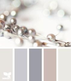 the color scheme is gray and white with silver beads on it, along with other colors