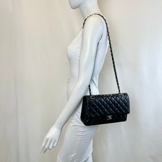 Chanel 2020 Classic Medium Double Flap Bag with Silver-tone Hardware and Turn-Lock at Front, Chain Link Shoulder Strap (Includes Authenticity Card, Seal, Dustbag) Est. Retail: $10,800, Minor Discoloration on Interior) Designer = Chanel Color = Black Material = Lamb Skin Condition = Good Height = 6 Width = 10 Depth = 2.5 Class = Premier Location: Chicago Item Number: 20559-10 Item ID: 302070 Category: Shoulder Bag Elegant Double Flap Shoulder Bag For Shopping, Black Double Flap Bag For Daily Use, Classic Bags With Chain Strap For Shopping, Double Flap Shoulder Bag With Dust Bag, Chic Black Double Flap Shoulder Bag, Travel Bag With Chain Strap And Double Flap, Travel Bag With Double Flap And Chain Strap, Modern Black Flap Bag With Chain Strap, Designer Double Flap Shoulder Bag With Chain Strap