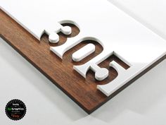 a wooden sign that reads 350 on it and has the word 350 spelled in white letters