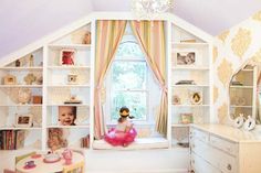 a child's room with shelves, dressers and a doll in the window