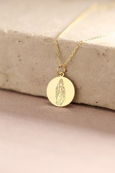 Gold Virgin Mary Pendant - Virgin Mary Gold Necklace ● Material of pendant: Solid Gold 14k ( REAL GOLD ) ● Metal Stamp: 14k ( REAL GOLD ) ● The pendant is available in 5 sizes: - 12,7 mm / 0.5 inches (Diameter) - 14,0 mm / 0,55 inches ( Diameter ) In the photos - 15,3 mm / 0.6 inches ( Diameter ) - 16,5 mm / 0,65 inches ( Diameter ) - 19,1 mm / 0,75 inches ( Diameter ) ( In the photos the size is 14mm / 0.55 inches Diameter ) ( Jump Ring inner diameter: 4 mm ) ● Material of chain: Solid gold 14k Medallion Necklace As Gift For Mom, 14k Stamped Round Pendant Necklace As Gift, Yellow Gold Necklaces With Round Pendant For Mom, Yellow Gold Round Pendant Necklace For Mom, Engraved Pendant Necklace Gift, Gold Necklace With Round Pendant As Gift, Yellow Gold Round Pendant Necklace Gift For Mom, Engraved Pendant Necklace As Gift, White Gold Medallion Necklace For Gift