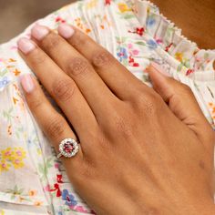 The Story A timeless cluster ring with a striking stone at center. Sitting at the center of this piece is a richly colored spinel weighing approximately 1.17 carats. The vintage cut stone is saturated in a red hue. Prong set, it's surrounded by a halo of 13 chunky Old Mine cut diamonds, weighing 0.04 to 0.05 carats each, giving the ring a total diamond weight of approximately 0.59 carats. The setting, from circa 1905, was beautifully paired with the vintage cut spinel which was added at a later date. The center spinel makes it pop with color. It looks amazing on the hand with its universally flattering shape and size. We love it on its own or paired with other favorite pieces. It would make a fantastic engagement ring for someone looking for a unique and colorful piece. The Specs Style Num Fine Jewelry Diamond Cluster Gemstones, Elegant Ruby Wedding Ring With Halo, Diamond Cluster Ring With Accent Stones And Round Cut, Elegant Halo Lab-created Ruby Jewelry, Formal Halo Jewelry With Lab-created Ruby, Diamond Cluster Sapphire Ring, Cluster Sapphire Ring With Diamond Center Stone, Luxury Ruby Cluster Ring With Center Stone, Fine Jewelry Ruby Ring With Center Stone For Anniversary