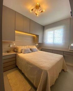 a bedroom with a bed, dressers and lights on the ceiling is shown in this image