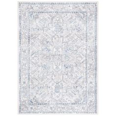 a blue and white rug with an intricate design on the bottom, in front of a white background