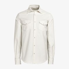 A collection standout with some definitive American flair, this western-style off-white shirt is tailored slim with a stitched-on placket, pointed flap pockets, snap buttons, and classic collar-perfect on its own or layered over a t-shirt for an effortless casual style. White Cotton Shirt With Concealed Placket, Classic Tops With Flap Pockets For Work, Classic Shirt With Concealed Placket For Fall, White Shirt With Welt Pockets And Spread Collar, Classic Collared Tops With Flap Pockets, Fitted Tops With Flap Pockets And Lapel Collar, White Shirt With Johnny Collar And Placket, Classic Shirt With Johnny Collar, Classic Shirt With Flap Pockets And Lapel Collar