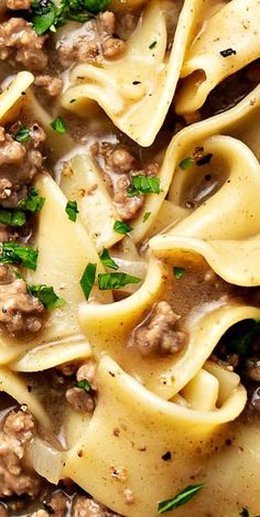 a close up view of some pasta and meat sauce