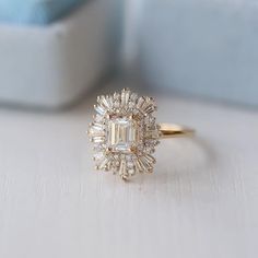 a diamond ring sitting on top of a table