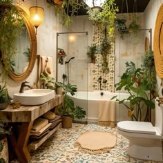 a bathroom that has plants on the wall