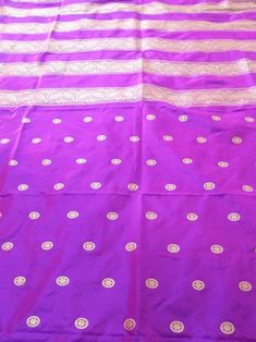 This Banarasi handloom pure silk lehenga is a perfect festive/wedding/occasional wear it enhanced with purple color motifs.  Occasion: party wear/wedding  Materials. Pure silk. Unstich  Fabric design - Banarasi shikargah lehenga  Pattern: paisley/buti motifs.  Borders: yes  Border type: Zari  Zari type: golden zari  Fabric length with blouse and with dupatta.  Borders is 6.5 meters  Blouse: 0.85 Meters  No of kali: 18 Size of kali 42 inch  No of border in dupatta 9 Purple Anarkali Traditional Handloom Wear, Purple Silk Sharara For Navratri, Purple Silk Sharara With Pallu, Traditional Purple Sharara For Festive Occasions, Purple Chanderi Sharara With Traditional Drape, Purple Chanderi Sharara With Pallu, Purple Chanderi Traditional Wear For Navratri, Traditional Purple Sharara With Dupatta, Purple Traditional Drape Sharara